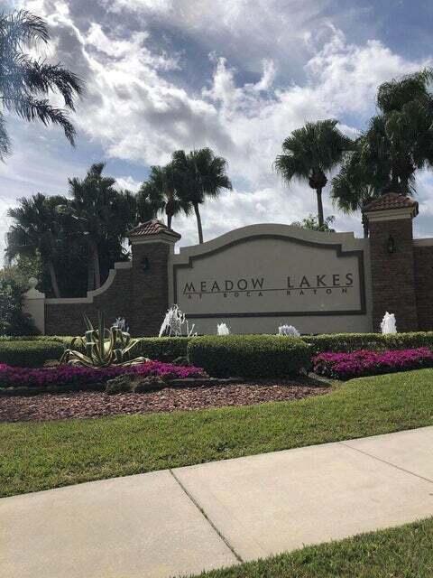 23344 Sunview Way Boca Raton, FL 33428 - Photo 2 of 23 a front view of a house with a garden and pathway