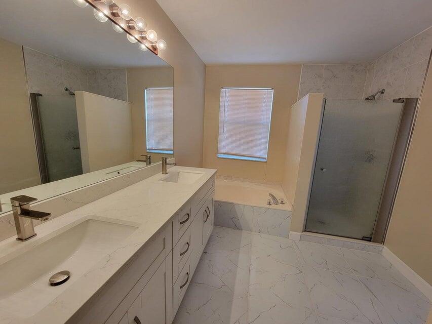 23344 Sunview Way Boca Raton, FL 33428 - Photo 21 of 23 a bathroom with a tub sink and mirror