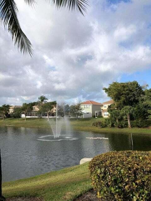 23344 Sunview Way Boca Raton, FL 33428 - Photo 4 of 23 a view of a lake with houses in the background