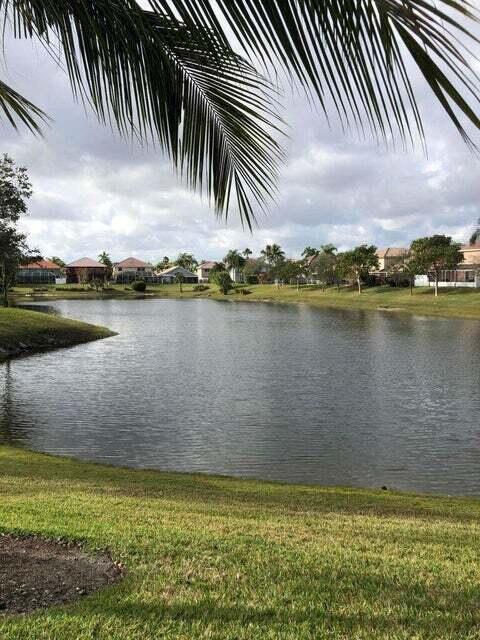 23344 Sunview Way Boca Raton, FL 33428 - Photo 5 of 23 a view of a lake with a city