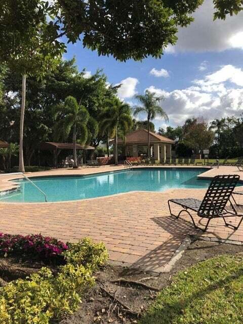 23344 Sunview Way Boca Raton, FL 33428 - Photo 6 of 23 a view of a lake with a yard