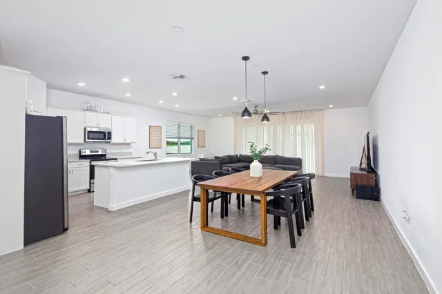 a living room with furniture and a table