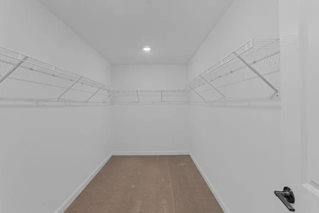 a view of a house with backyard and garden