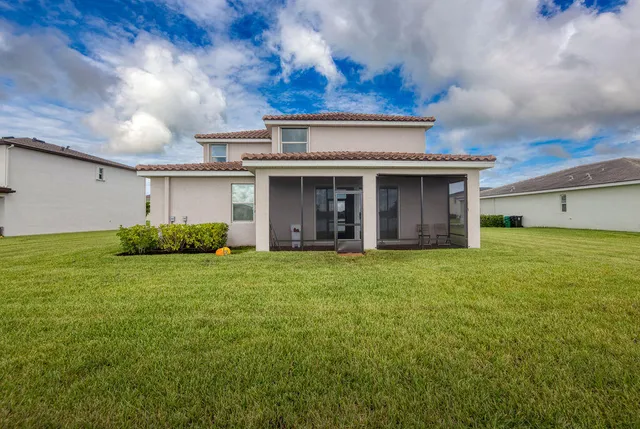 a view of a swimming pool with an outdoor seating