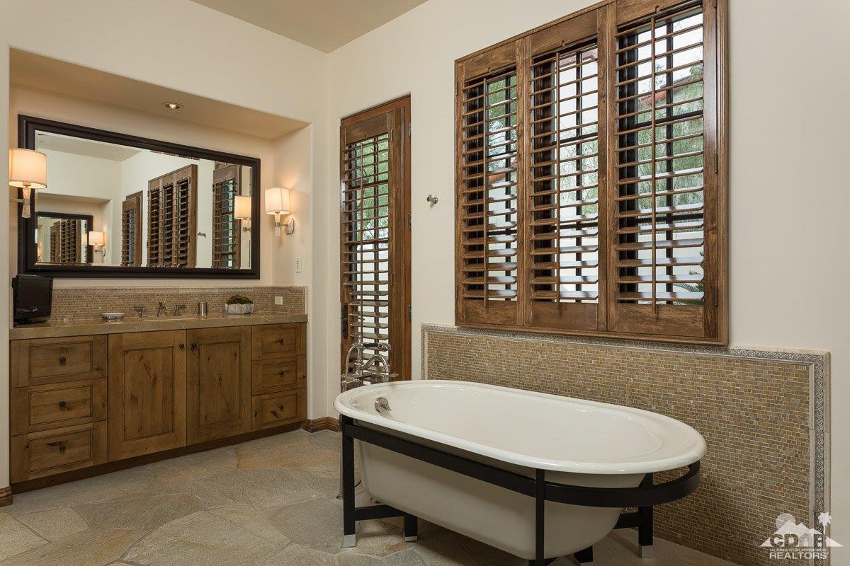 1 Santa Rosa Mountain Lane Rancho Mirage, CA 92270 - Photo 11 of 23 a bathroom with a sink a toilet and large mirror