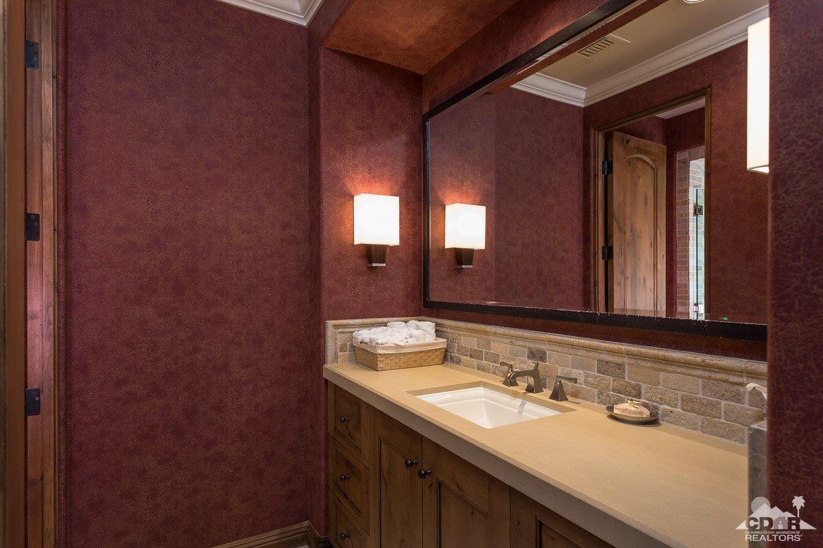 1 Santa Rosa Mountain Lane Rancho Mirage, CA 92270 - Photo 13 of 23 a bathroom with a sink and a mirror