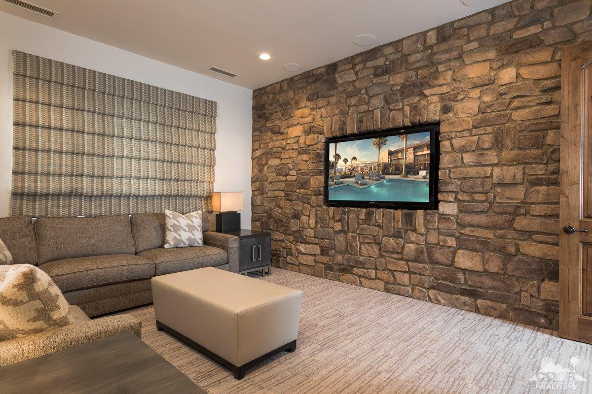 1 Santa Rosa Mountain Lane Rancho Mirage, CA 92270 - Photo 14 of 23 a living room with a couch and a flat screen tv