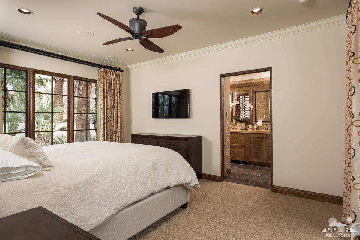 1 Santa Rosa Mountain Lane Rancho Mirage, CA 92270 - Photo 15 of 23 a bedroom with a bed and a large window