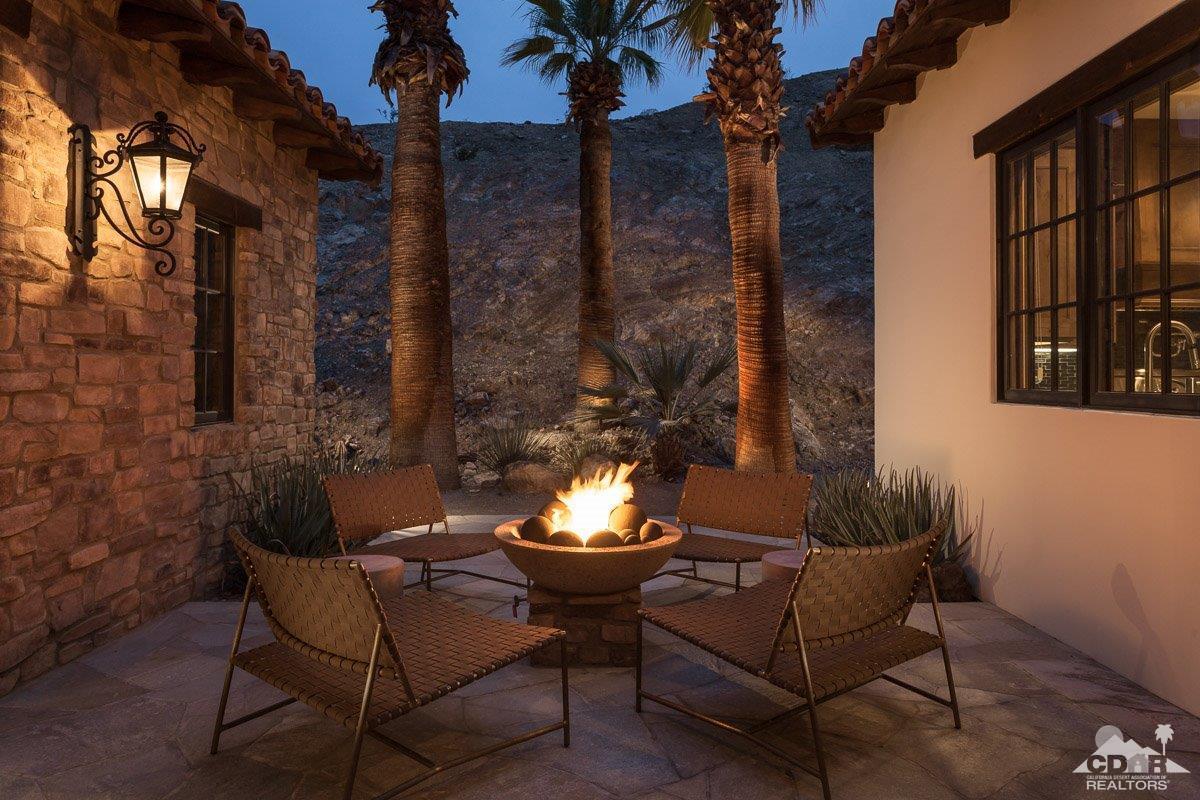 1 Santa Rosa Mountain Lane Rancho Mirage, CA 92270 - Photo 17 of 23 a view of a patio with couple of chairs and a fire pit