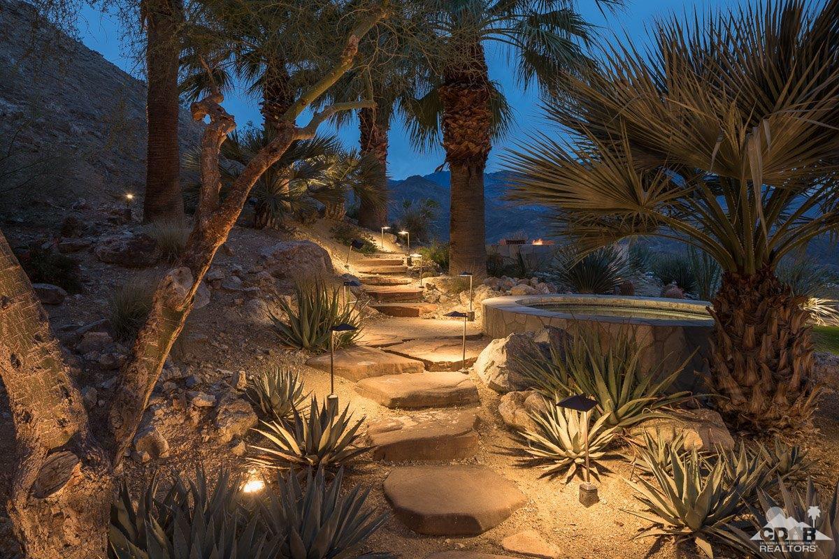 1 Santa Rosa Mountain Lane Rancho Mirage, CA 92270 - Photo 19 of 23 a view of swimming pool with a garden