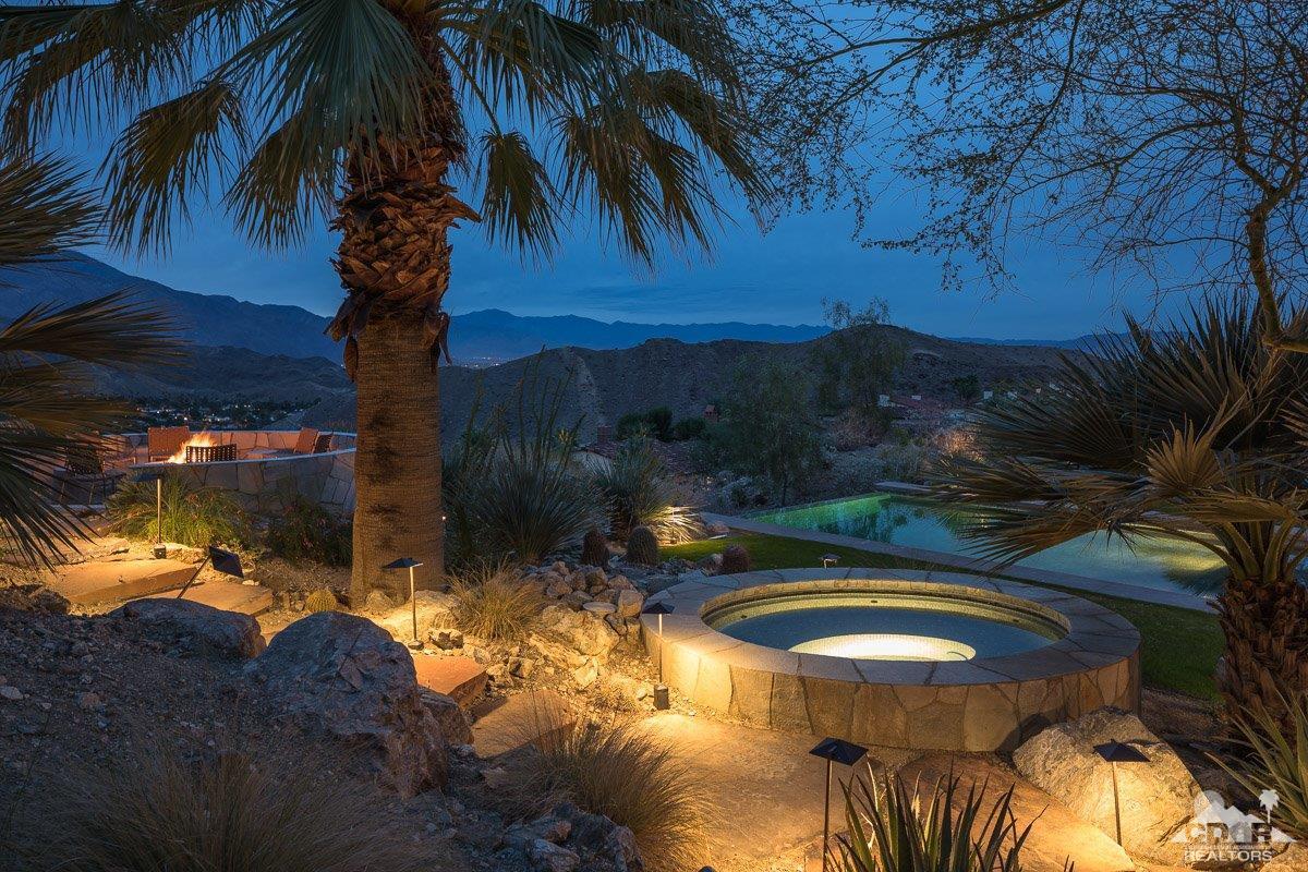 1 Santa Rosa Mountain Lane Rancho Mirage, CA 92270 - Photo 20 of 23 a view of a swimming pool with a yard fire pit table and chairs