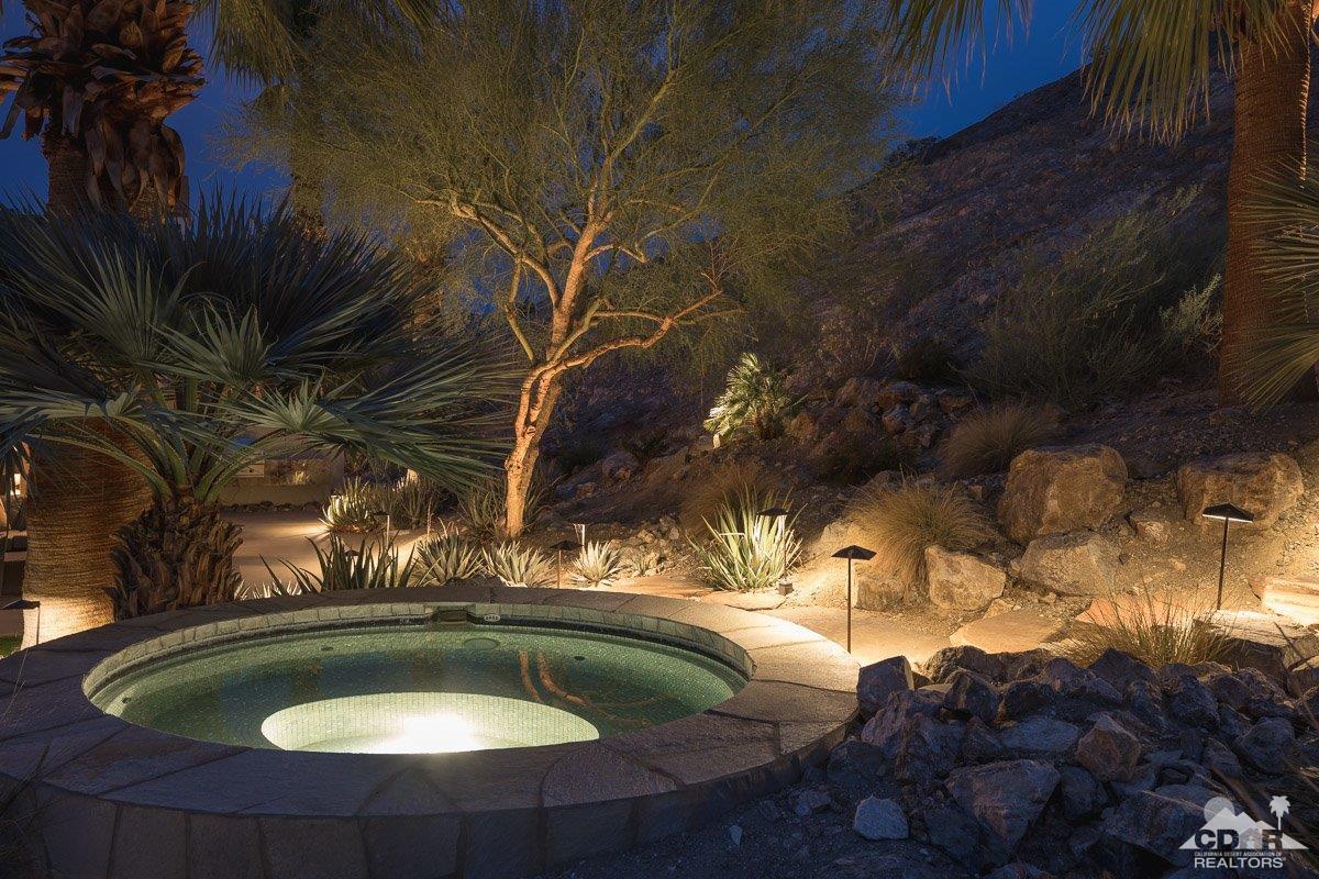 1 Santa Rosa Mountain Lane Rancho Mirage, CA 92270 - Photo 22 of 23 a backyard of a house with a yard fire pit and outdoor seating