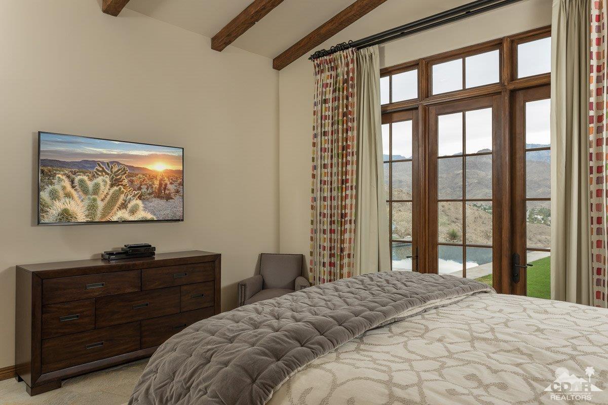 1 Santa Rosa Mountain Lane Rancho Mirage, CA 92270 - Photo 9 of 23 a bedroom with a bed and a window