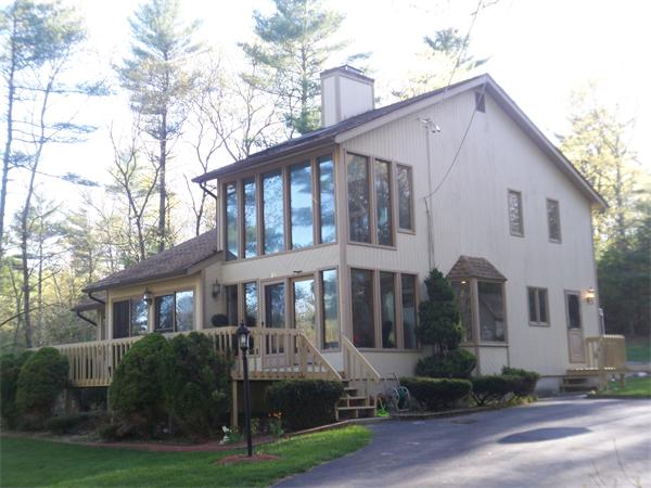 18 Dunham Road Freetown, MA 02702 - Photo 2 of 28 a front view of a house with garden