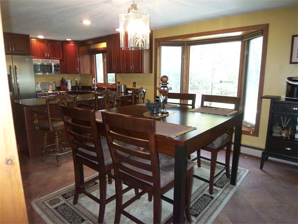 18 Dunham Road Freetown, MA 02702 - Photo 6 of 28 a kitchen with a dining table chairs and granite counter tops
