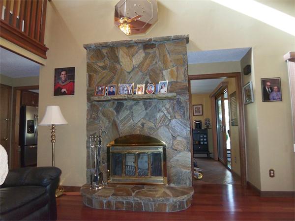 18 Dunham Road Freetown, MA 02702 - Photo 7 of 28 a fireplace with wooden floor