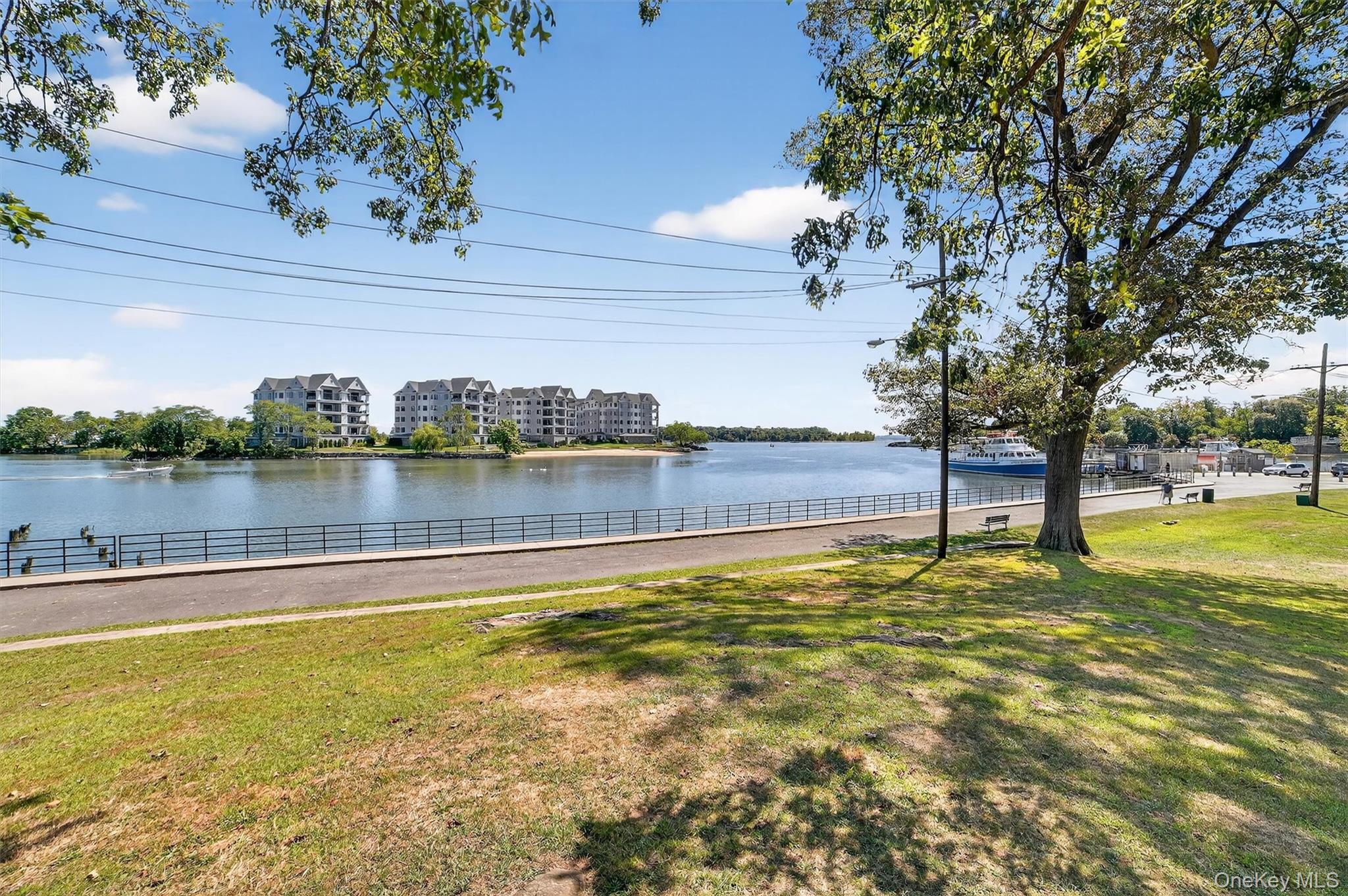 37 Harbor Lane, Unit 2A New Rochelle, NY 10805 - Photo 21 of 23 a view of a lake with a house in the background