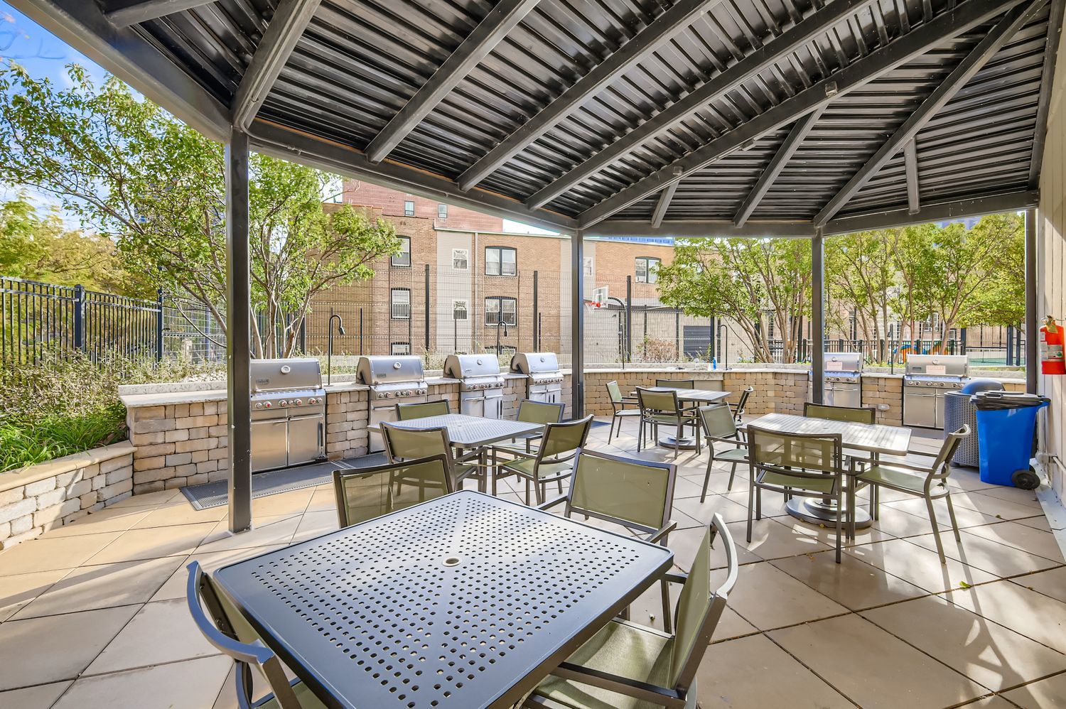 3930 North Pine Grove Avenue, Unit 805 Chicago, IL 60613 - Photo 14 of 15 a view of a patio with a table and chairs