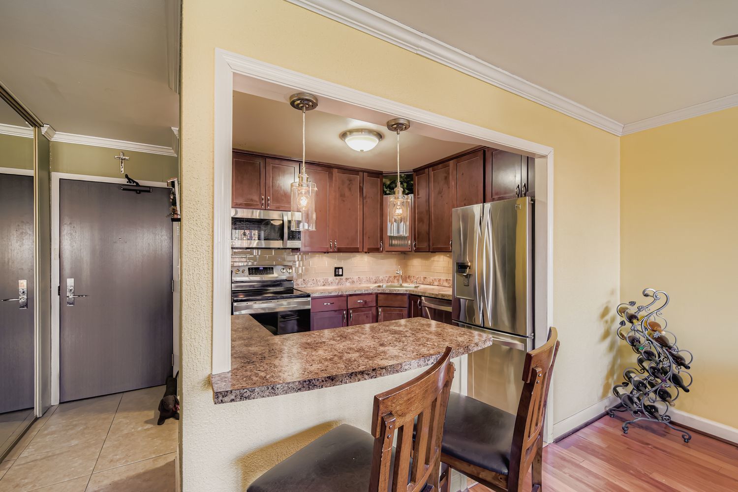 3930 North Pine Grove Avenue, Unit 805 Chicago, IL 60613 - Photo 4 of 15 a kitchen with refrigerator and cabinets