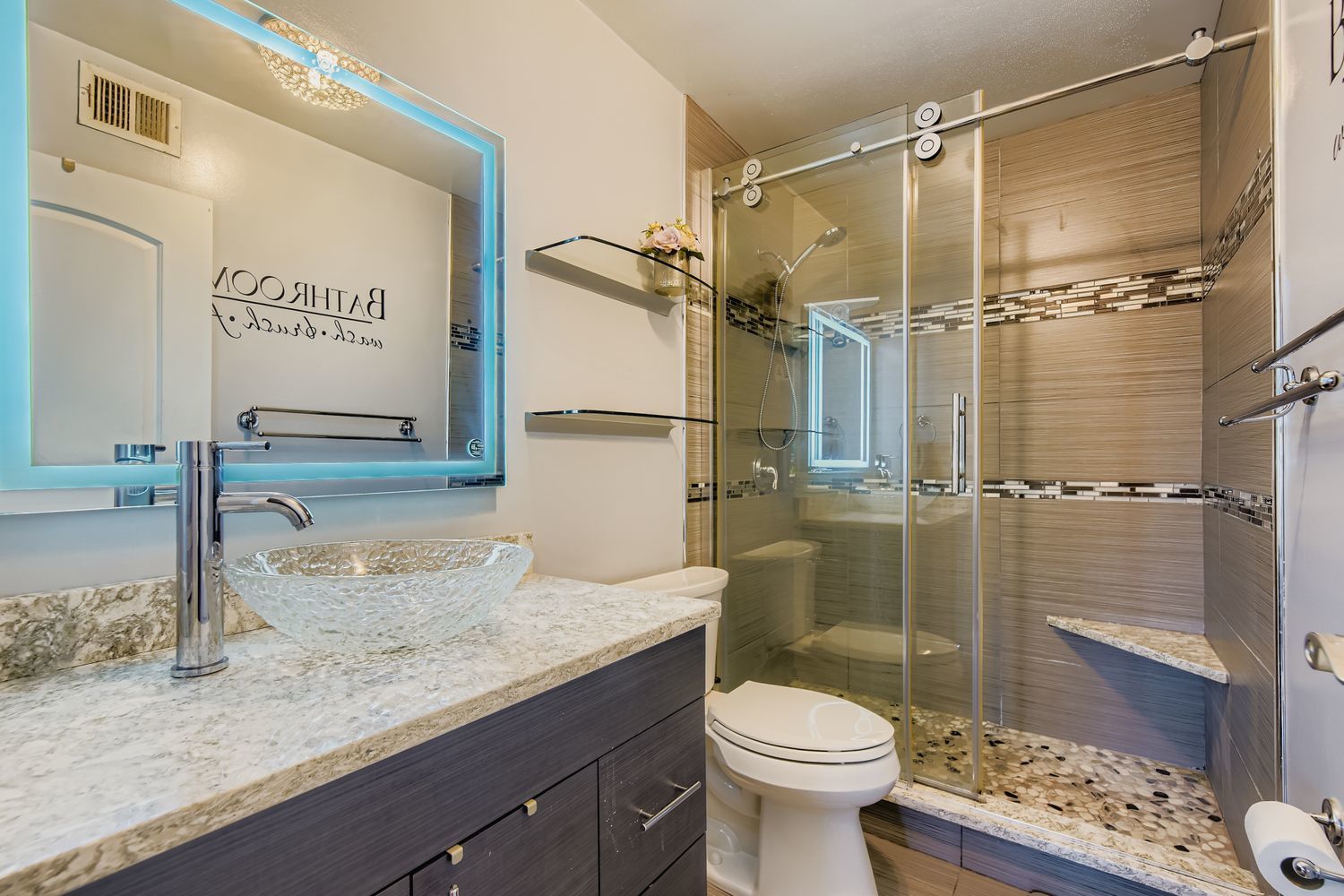 3930 North Pine Grove Avenue, Unit 805 Chicago, IL 60613 - Photo 9 of 15 a bathroom with a granite countertop sink toilet and shower