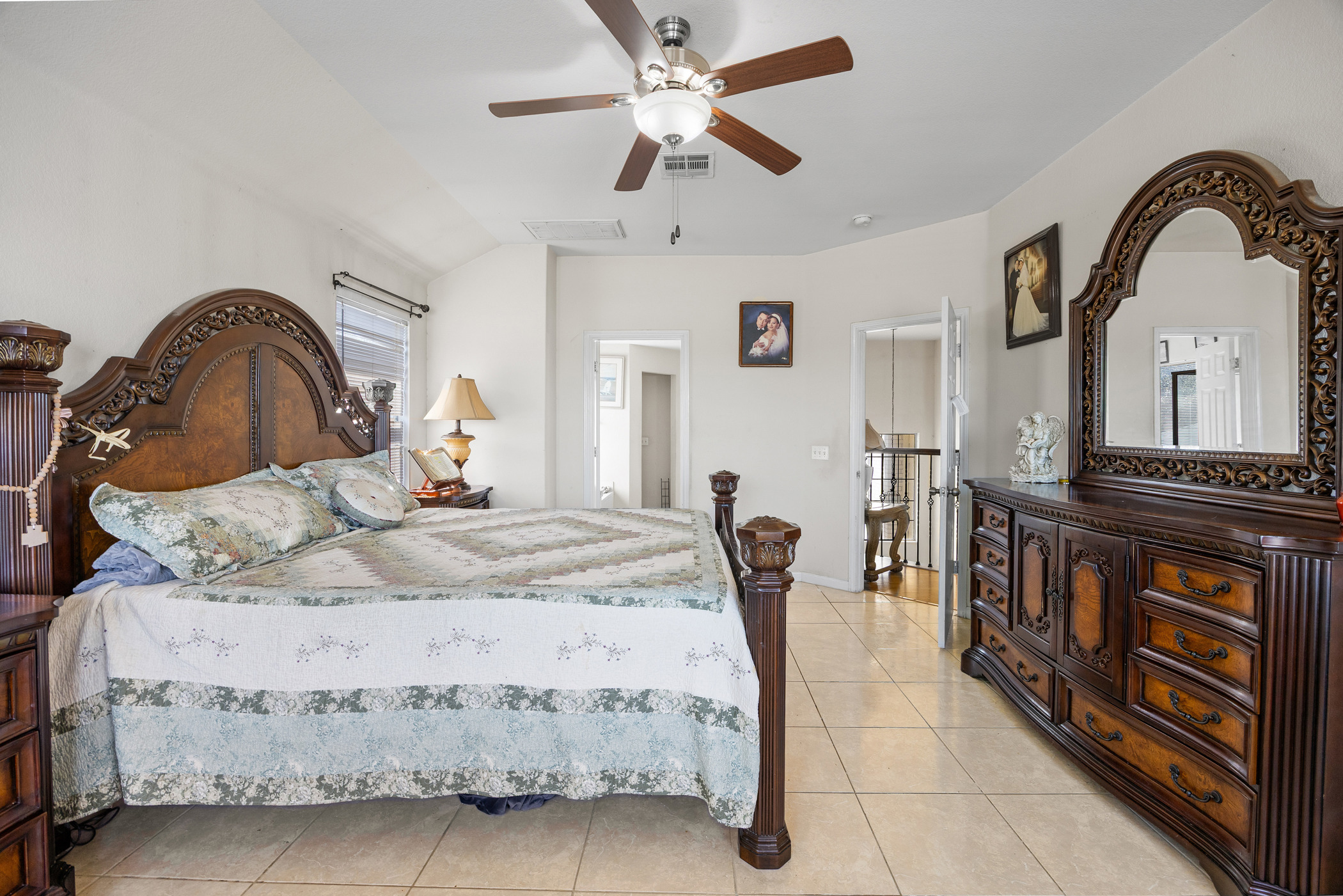 3502 Shiraz Loop Round Rock, TX 78665 - Photo 17 of 23 Bedroom with light tile patterned floors and ceiling fan