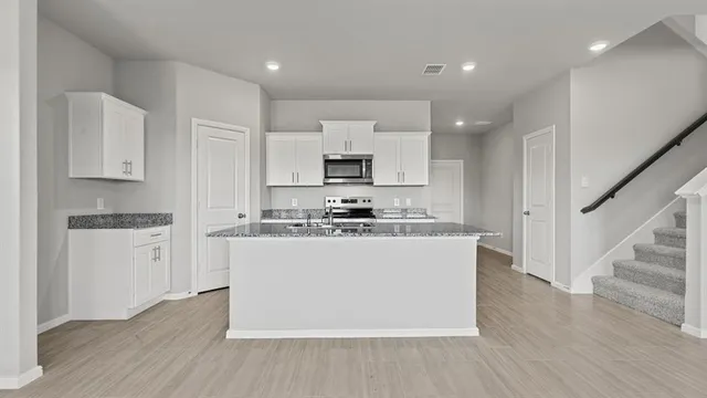 an empty room with closet area