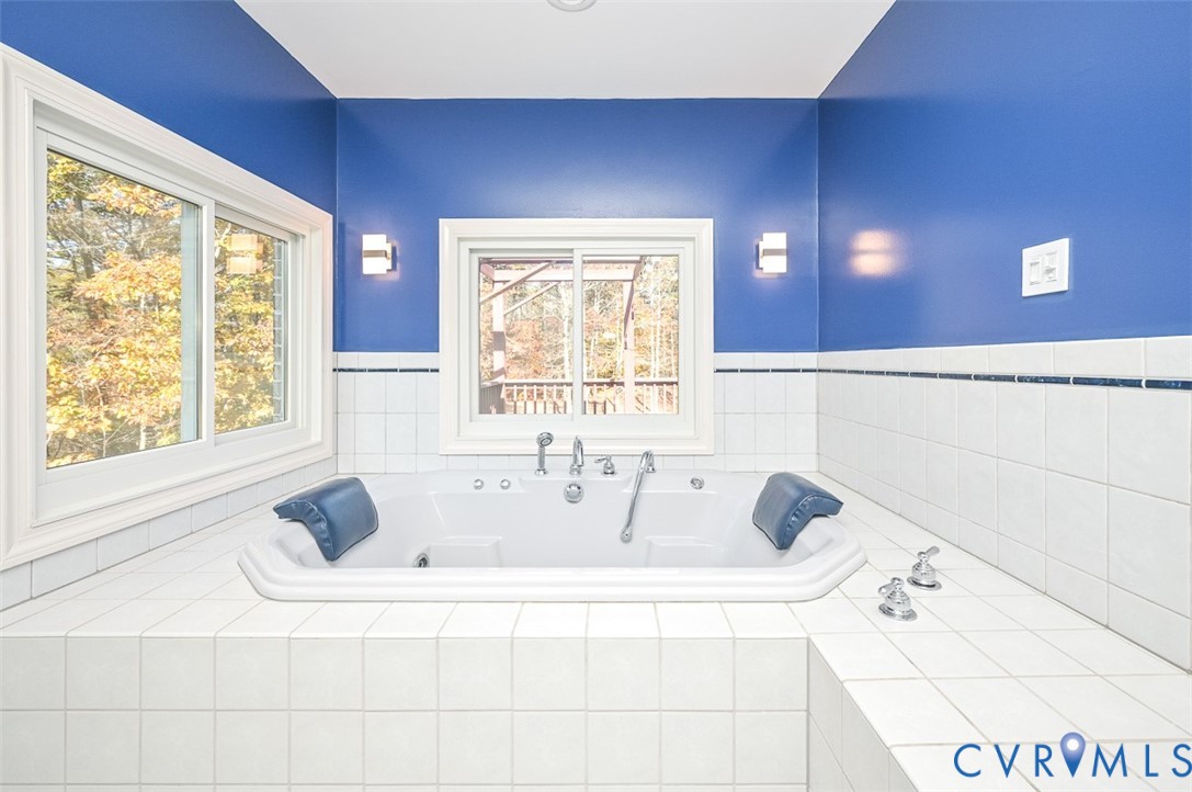 425 Starview Lane Gum Spring, VA 23065 - Photo 21 of 50 a white bath tub sitting in a bathroom next to a window