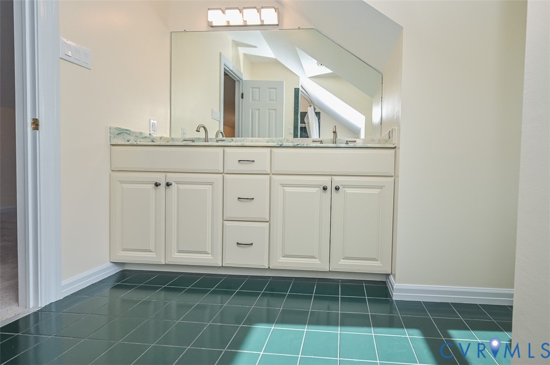 425 Starview Lane Gum Spring, VA 23065 - Photo 32 of 50 a bathroom with a sink a vanity and a mirror