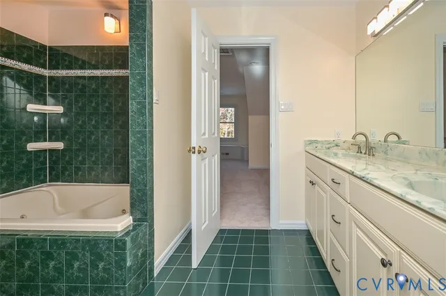 a blue couch sitting in a living room with a rug