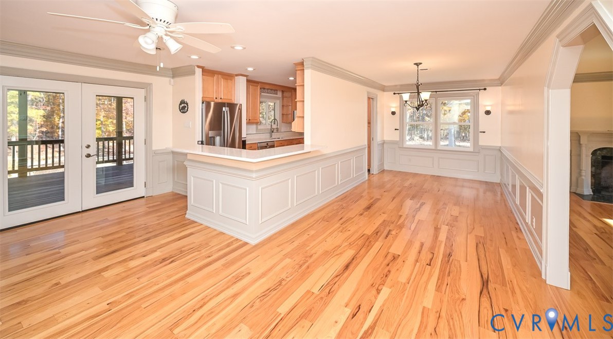 425 Starview Lane Gum Spring, VA 23065 - Photo 9 of 50 a large white kitchen with granite countertop a large counter top and stainless steel appliances