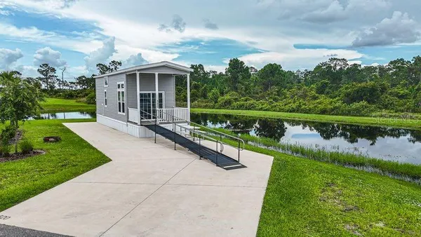 a view of house with a yard