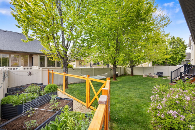 882 Sego Lily Way Mapleton, UT 84664 - Photo 34 of 41 Spacious backyard featuring a manicured lawn, established trees, and perimeter fencing