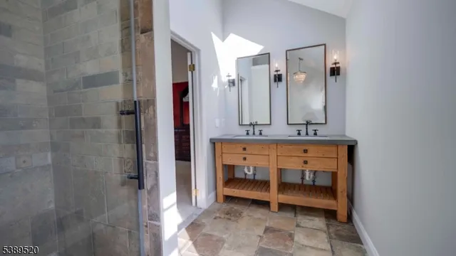 a bedroom with furniture and a mirror