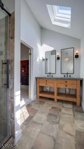 a bedroom with a bed window and dresser