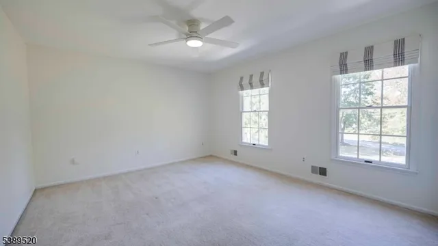 a bedroom with a bed couch and window