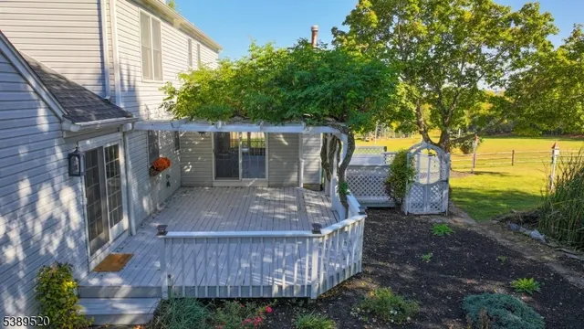an aerial view of a house with yard swimming pool and outdoor seating