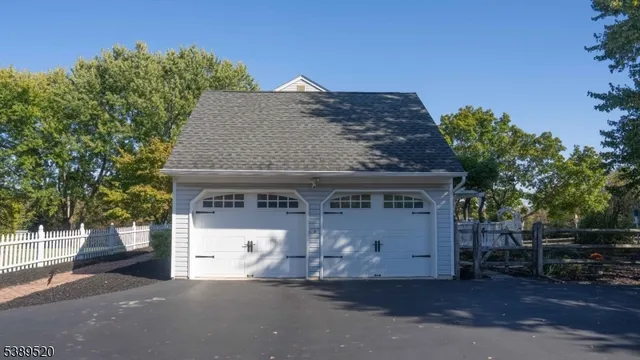 a view of a house with a yard in front of it