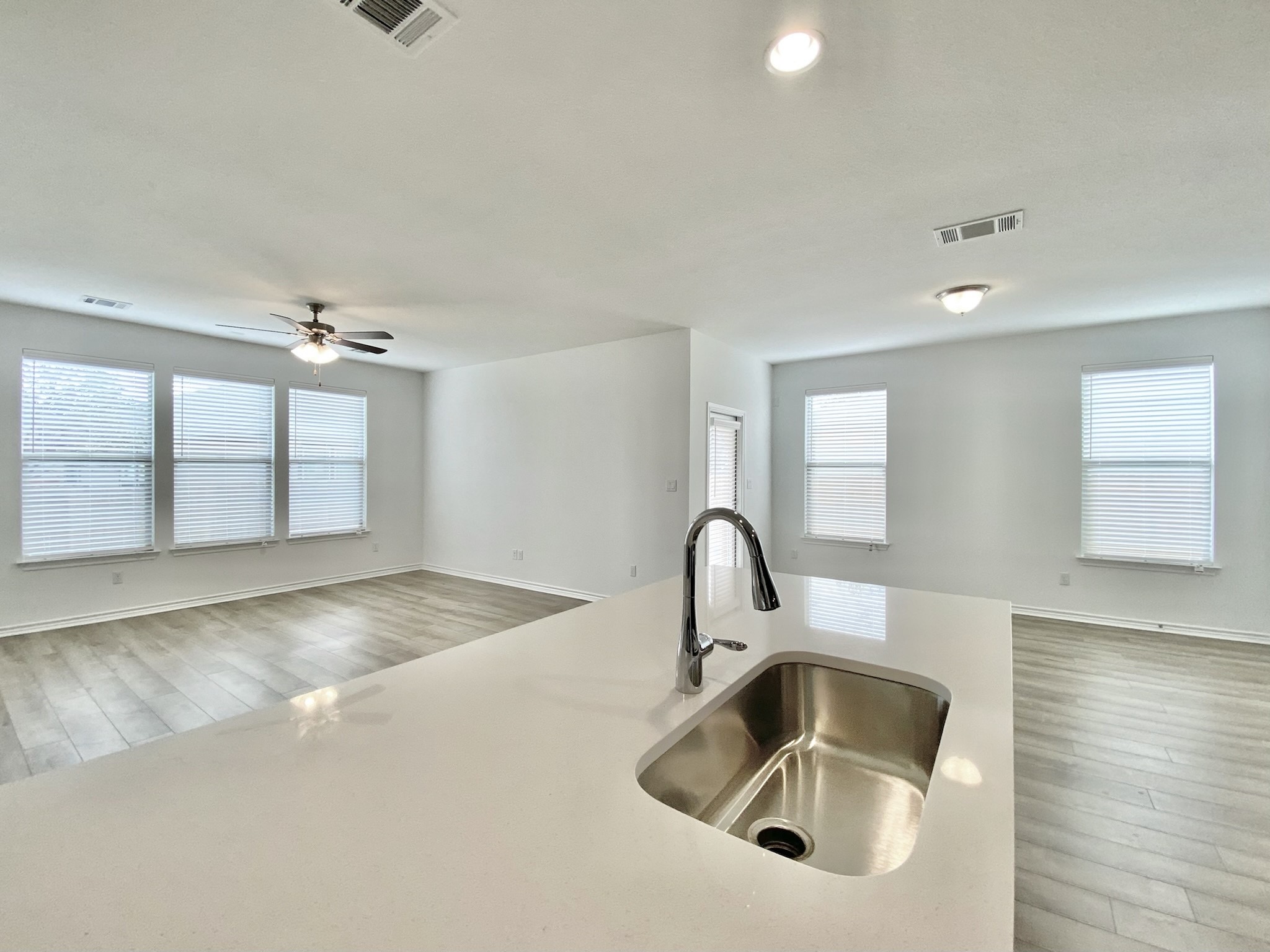 1852 Turtle Bay Loop Leander, TX 78641 - Photo 14 of 38 a kitchen with a sink and chandelier