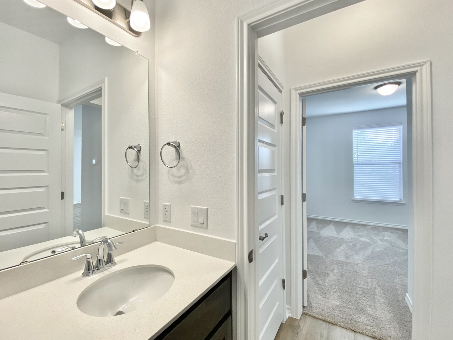 1852 Turtle Bay Loop Leander, TX 78641 - Photo 16 of 38 a bathroom with a sink vanity and mirror