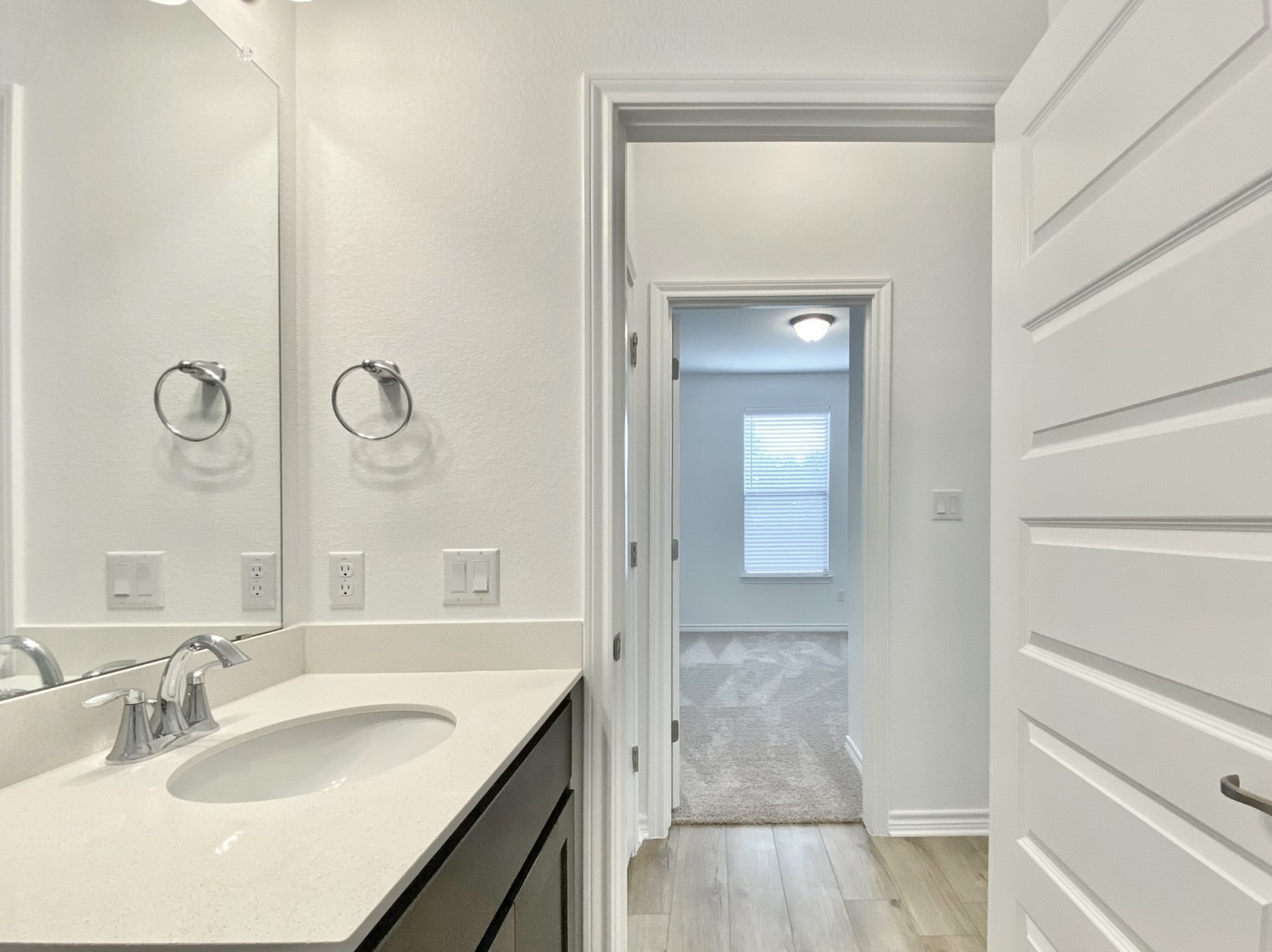 1852 Turtle Bay Loop Leander, TX 78641 - Photo 17 of 38 a bathroom with a sink and a mirror
