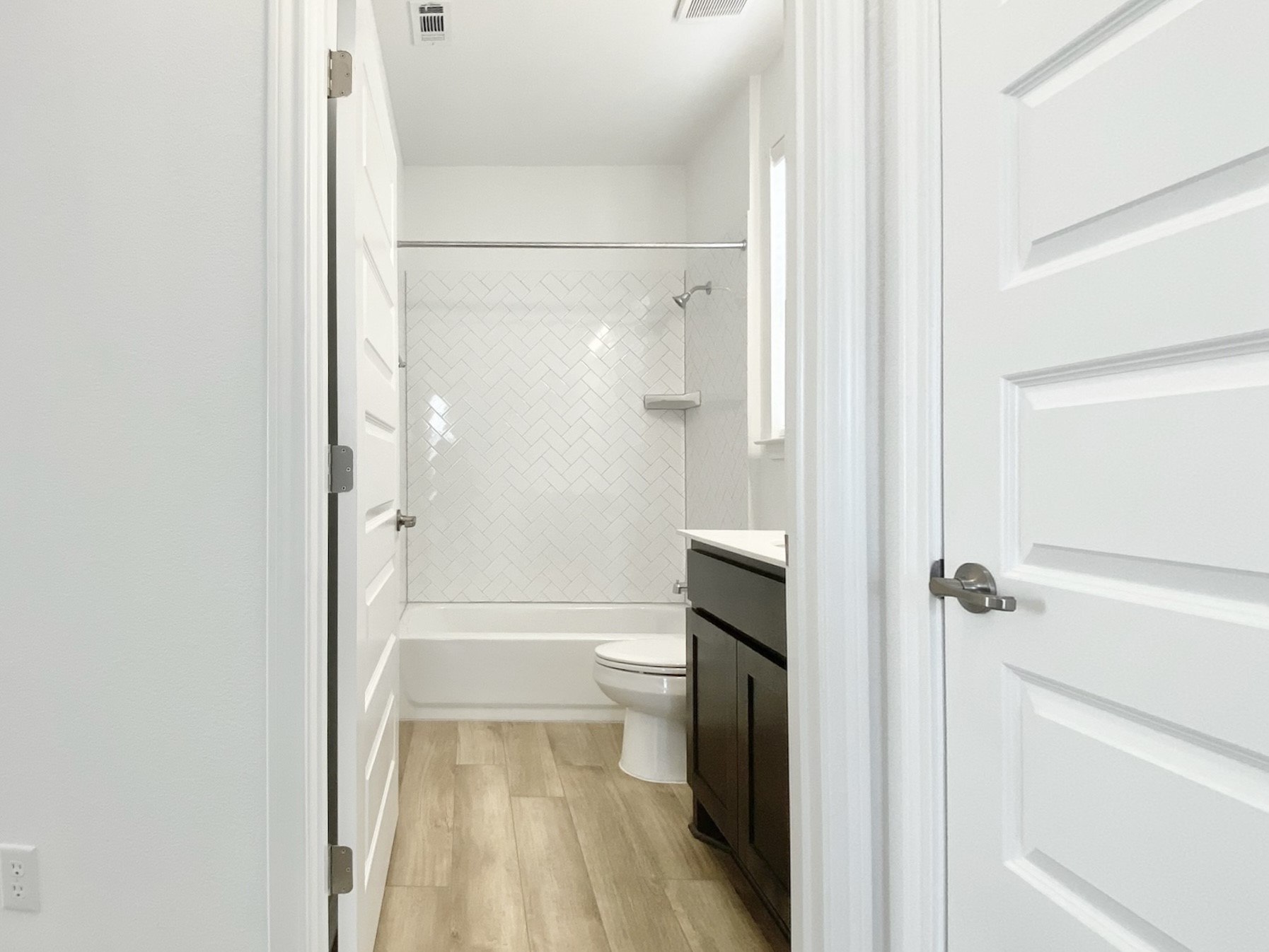1852 Turtle Bay Loop Leander, TX 78641 - Photo 19 of 38 a bathroom with a glass shower door