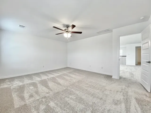 a spacious bathroom with a mirror a sink and shower