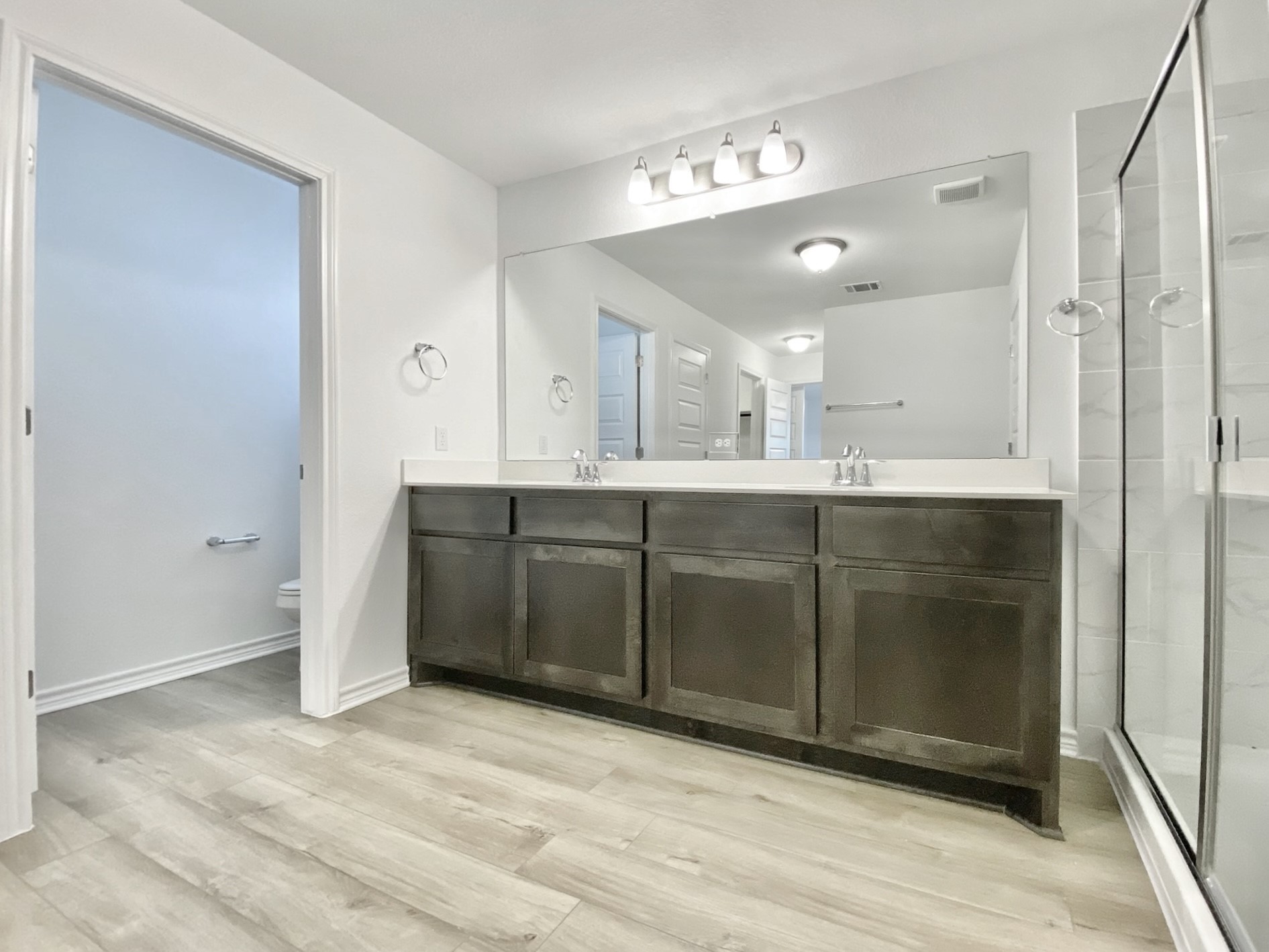 1852 Turtle Bay Loop Leander, TX 78641 - Photo 27 of 38 a view of a sink and a refrigerator in a room