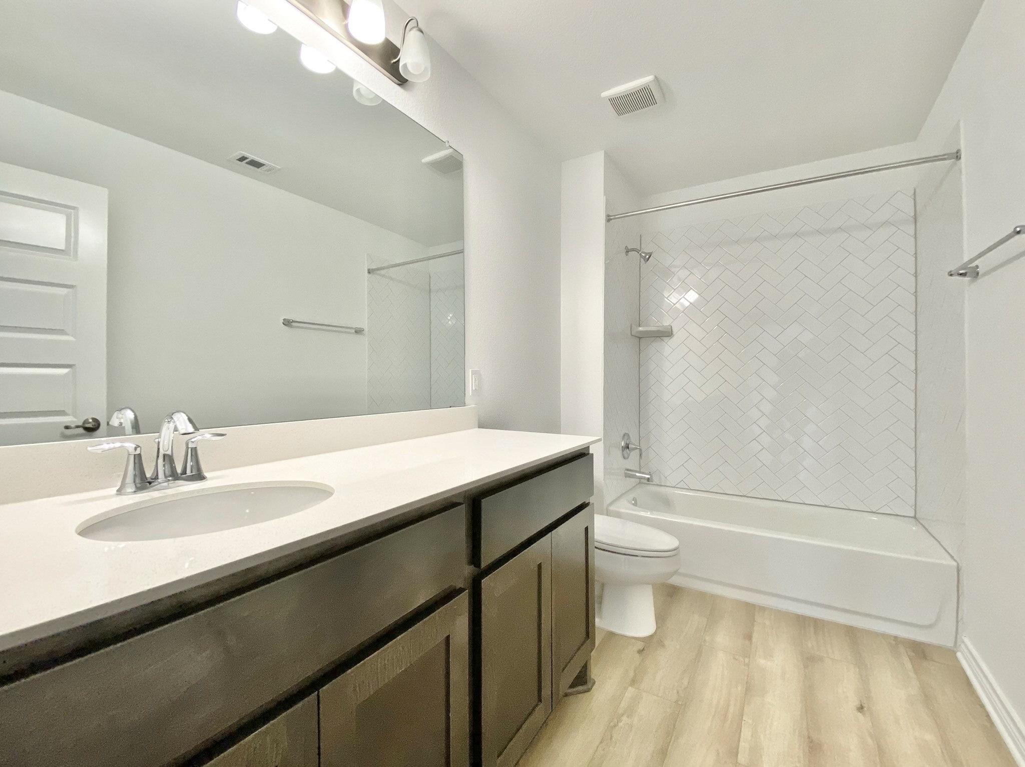 1852 Turtle Bay Loop Leander, TX 78641 - Photo 29 of 38 a bathroom with a sink a toilet and shower