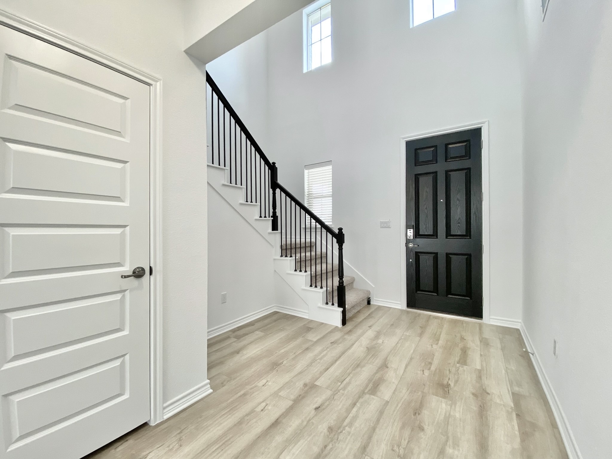 1852 Turtle Bay Loop Leander, TX 78641 - Photo 3 of 38 a view of entryway and hall with wooden floor