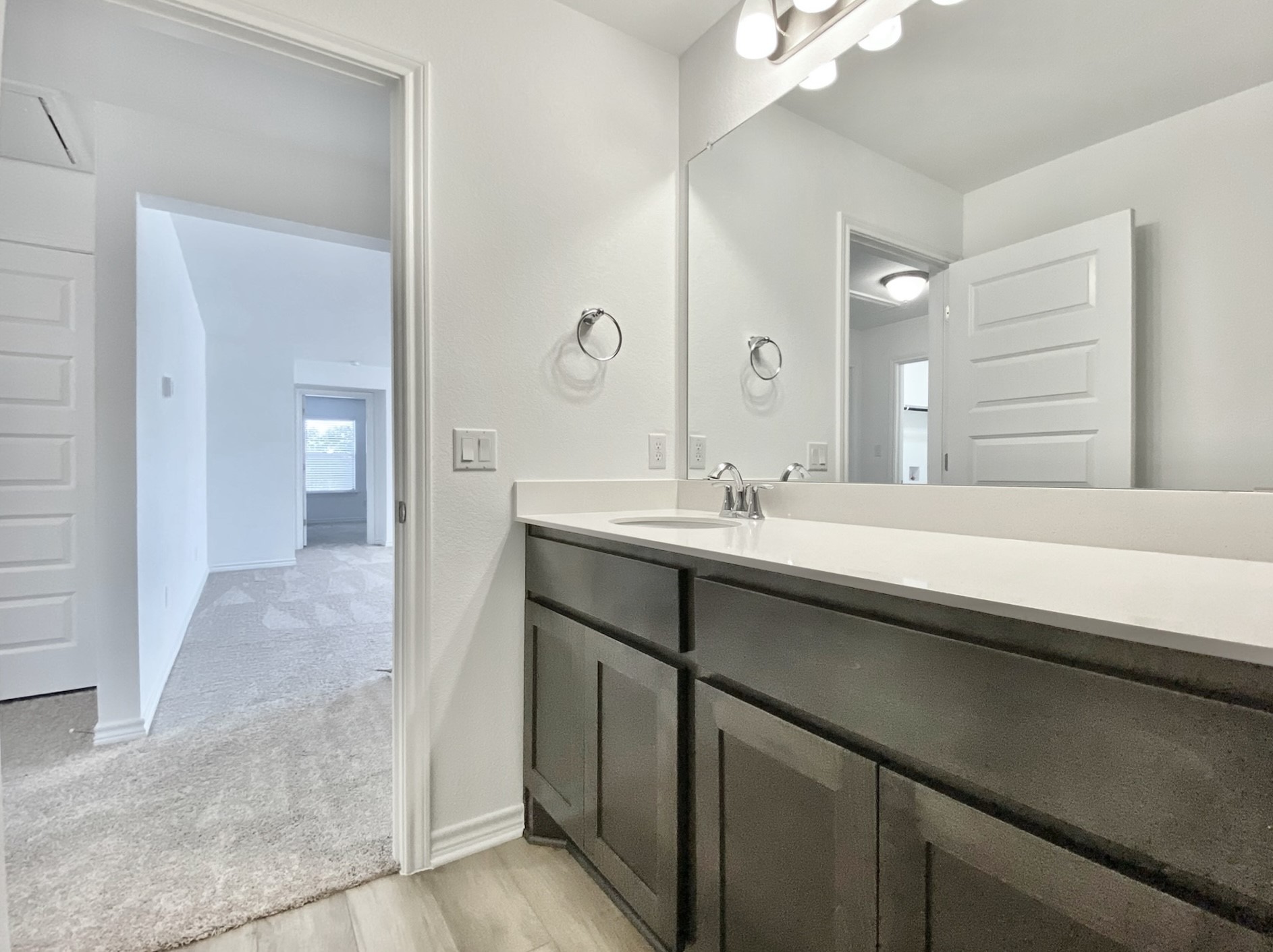 1852 Turtle Bay Loop Leander, TX 78641 - Photo 32 of 38 a bathroom with a sink and a mirror