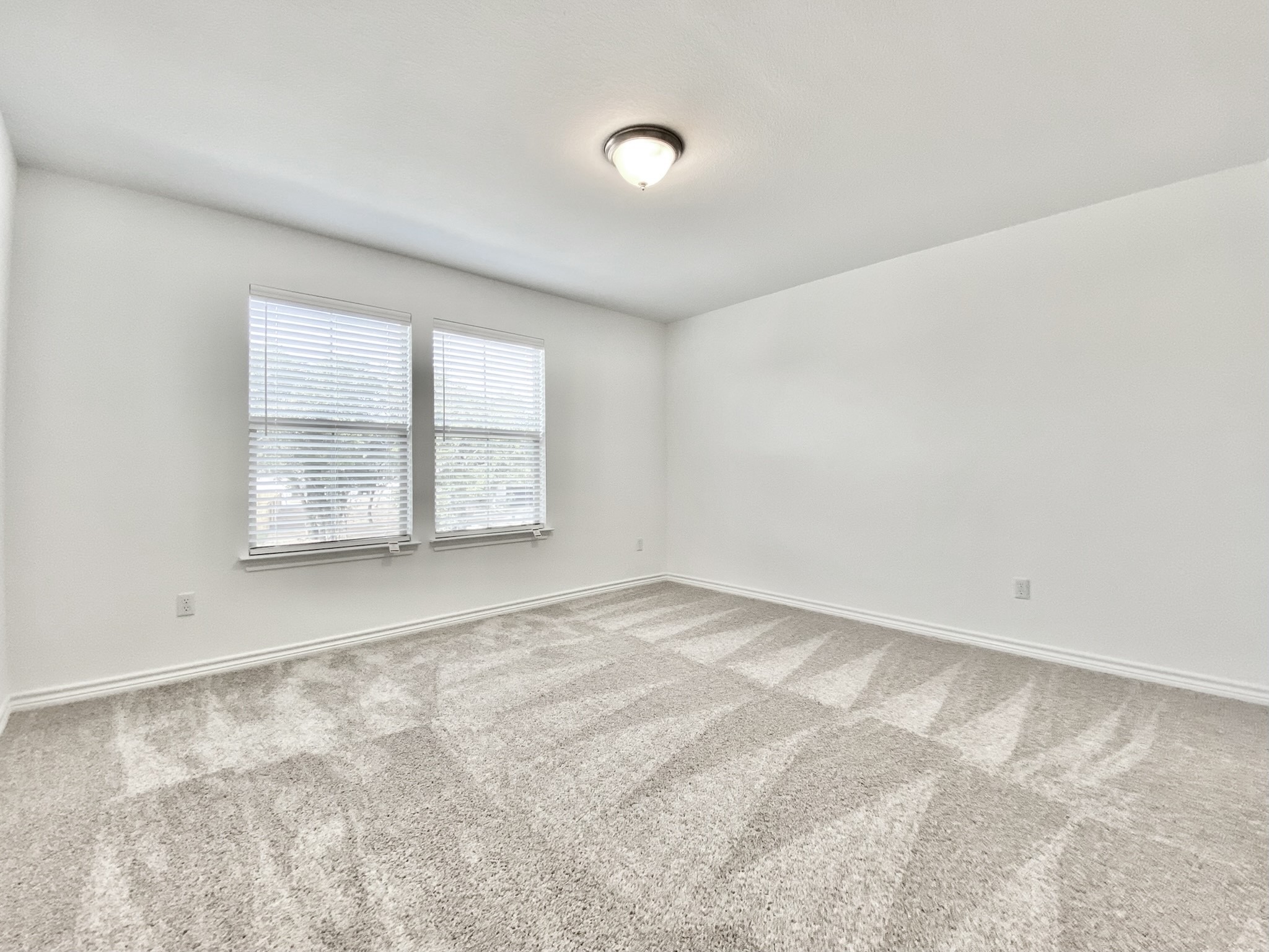 1852 Turtle Bay Loop Leander, TX 78641 - Photo 33 of 38 an empty room with windows