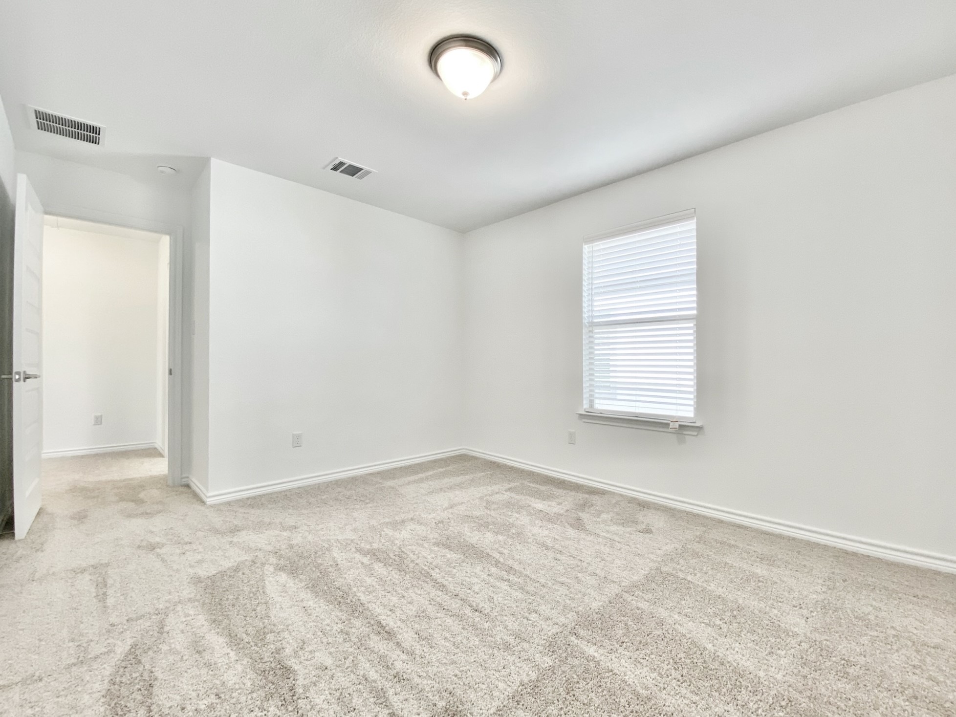 1852 Turtle Bay Loop Leander, TX 78641 - Photo 34 of 38 an empty room with windows and closet
