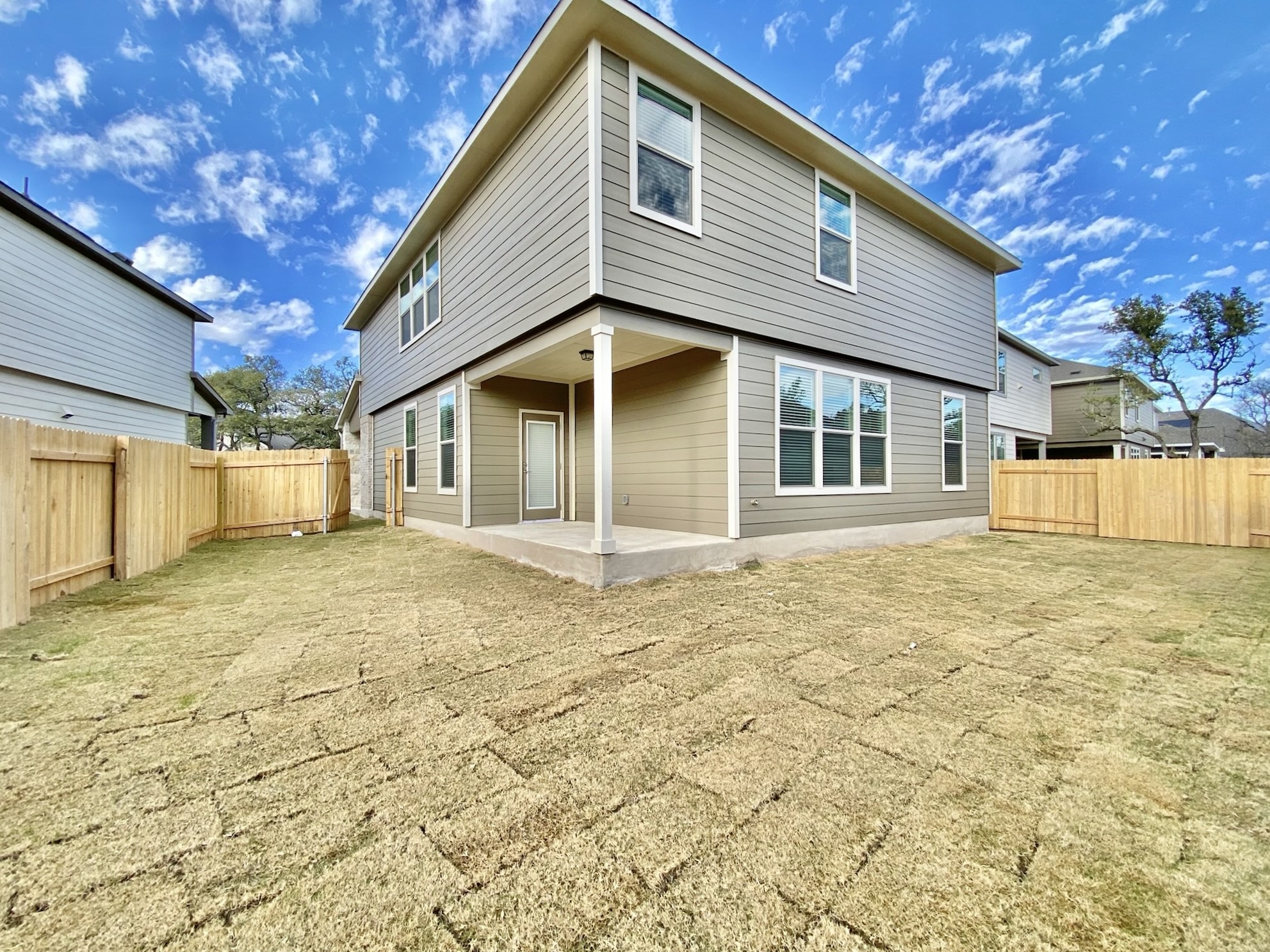 1852 Turtle Bay Loop Leander, TX 78641 - Photo 36 of 38 a front view of a house with a yard