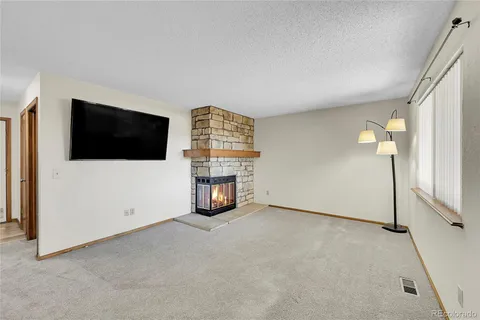 a view of an empty room with a flat screen tv